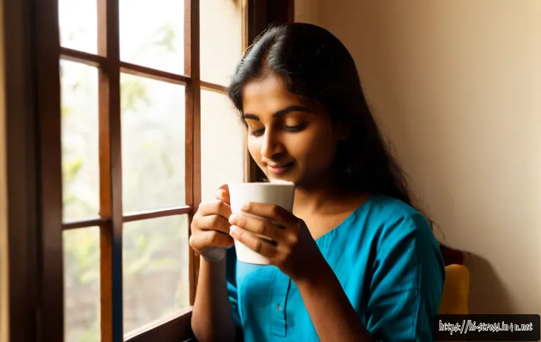 Home 17 스트레스 해소를 위한 커피 마시기 - Photorealistic calming morning scene of an Indian adult relaxing by a sunlit window, gently holding ...